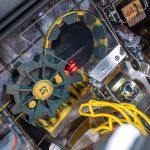 Fallout pinball playfield featuring the Vault entrance and mechanical targets
