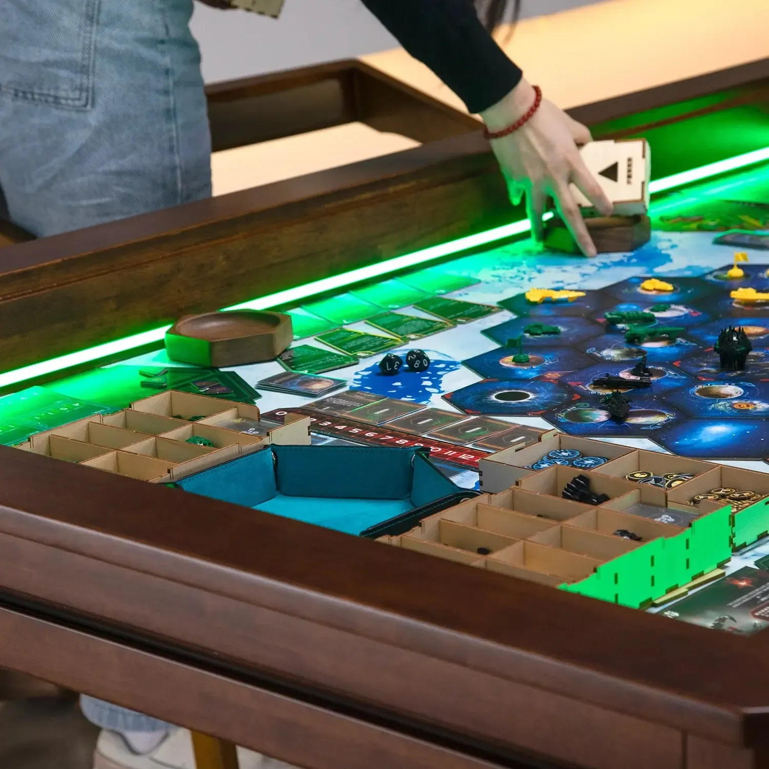 Kingswood 5ft board game table featuring an open vault game area with LED lights and board game accessories in use.