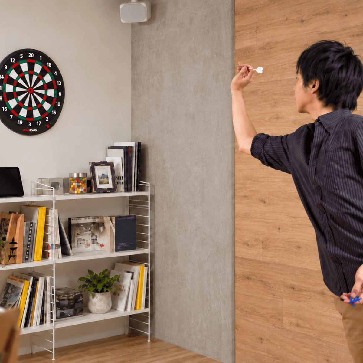 Player playing on the GranBoard Dash Green electronic dartboard.